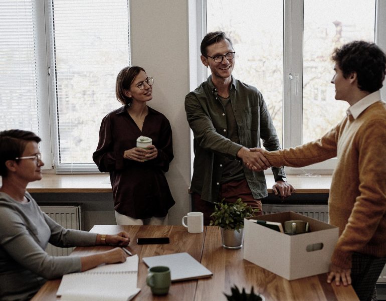 colleagues-welcoming-new-employee.jpg